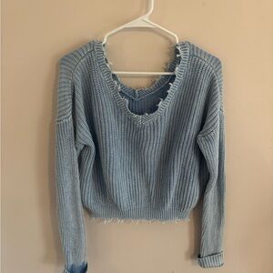 Distressed blue knit sweater